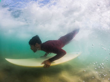 Young woman swimming in sea