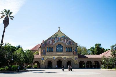 Facade of building against clear blue sky