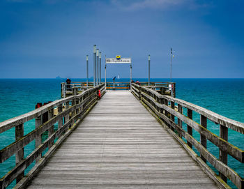 Pier over sea against sky