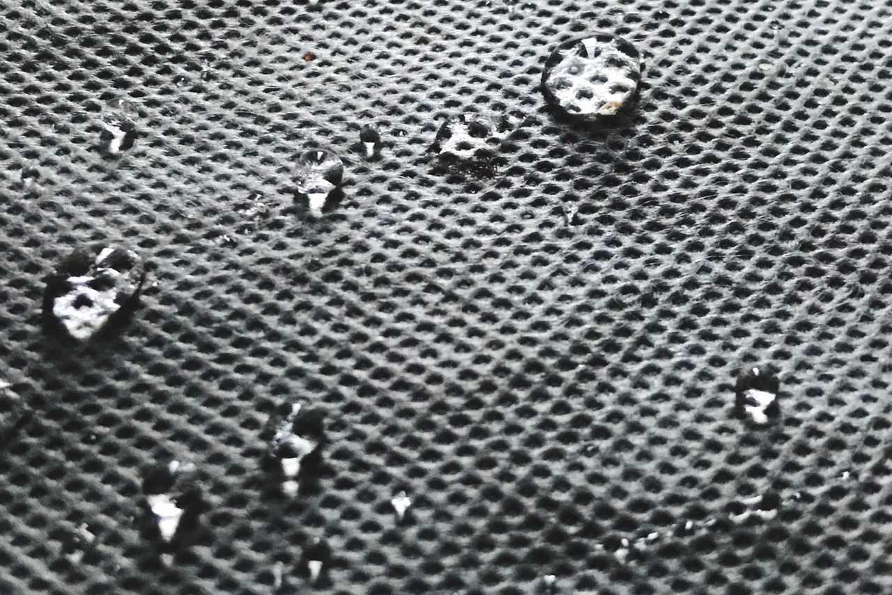 CLOSE-UP OF WATER DROPS ON FLOOR