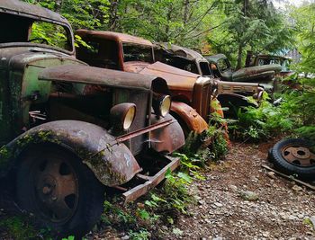 Old rusty machine on field