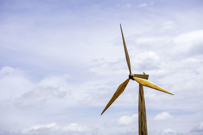 Low angle view of wind turbine against sky