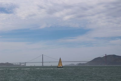 View of suspension bridge over sea