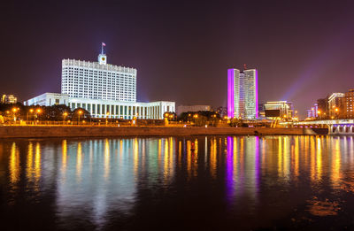 Illuminated buildings at waterfront