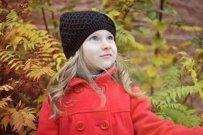 Portrait of girl in hat during winter