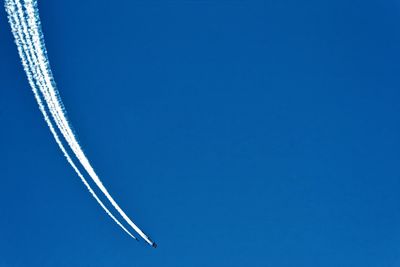 Low angle view of tree against clear blue sky