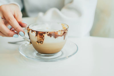 Close-up of coffee cup on table