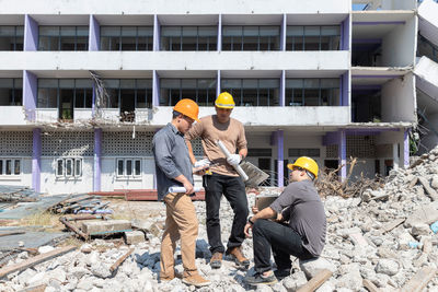 Rear view of man working at construction site