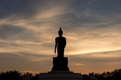 Low angle view of statue against sky during sunset