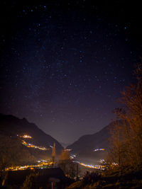 Scenic view of mountains against sky at night