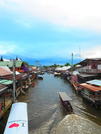 High angle view of boats on canal at floating market in city