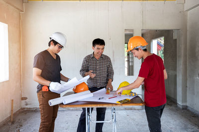 Side view of man working in workshop