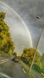 Scenic view of rainbow over road