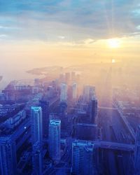 High angle view of buildings against sky during sunset