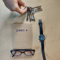 Close-up of hand holding eyeglasses