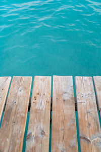 High angle view of wooden post by swimming pool