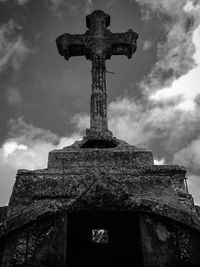 Low angle view of statue against sky