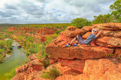 Woman relaxing on rock at kalbarri national park