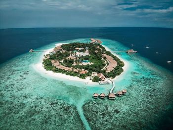 High angle view of swimming pool by sea against sky