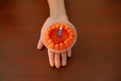 Midsection of person holding ice cream