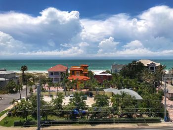Scenic view of swimming pool by sea against sky