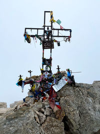 Low angle view of summit cross on piz boé, dolomites, trentino and alto adige against clear sky