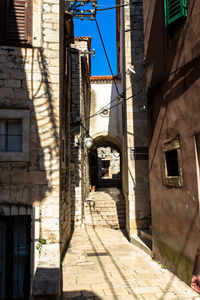 Narrow alley amidst buildings in town