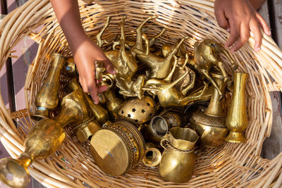 Midsection of person holding wicker basket