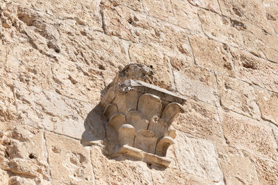 Low angle view of stone wall