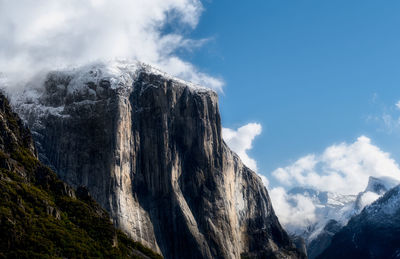 Low angle view of snowcapped el capitan against sky