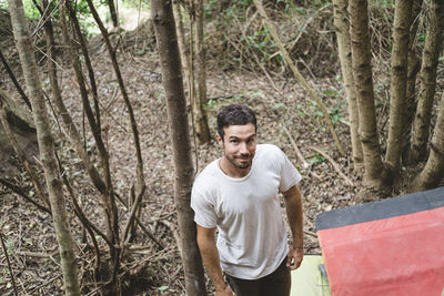 Portrait of a young rock climber in the forest