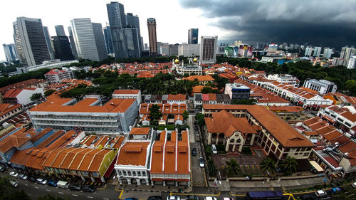 High angle view of buildings in city against sky