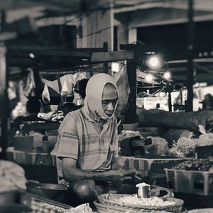 Man working at market stall