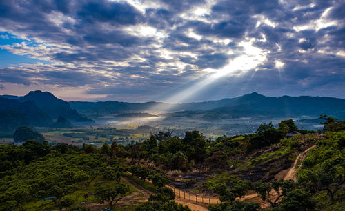 Scenic view of landscape and mountains against sky