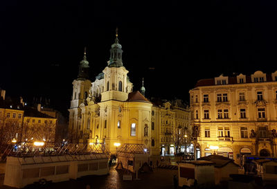 Illuminated buildings in city at night