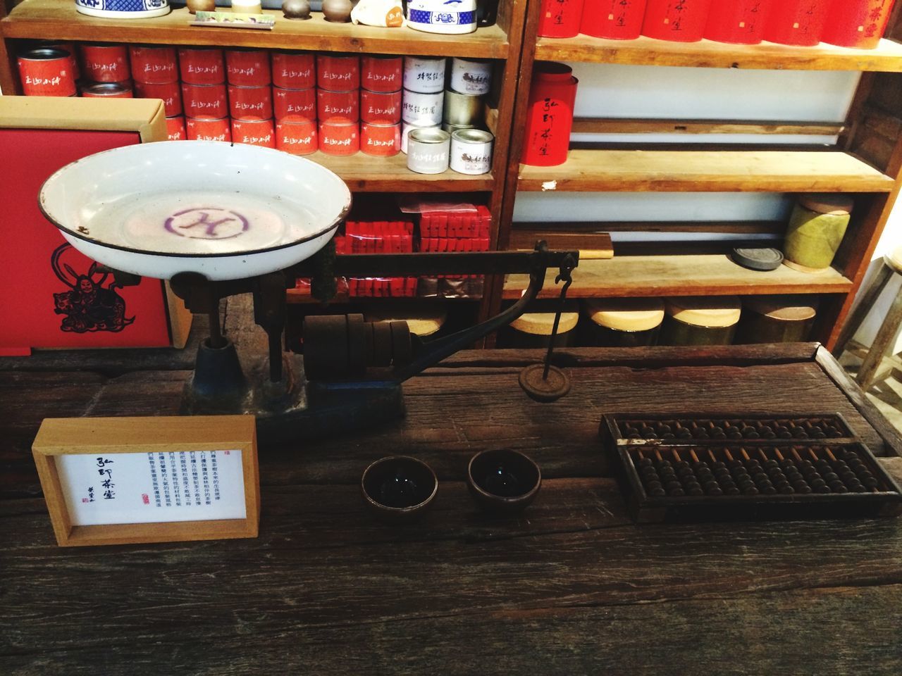 indoors, table, communication, still life, wood - material, high angle view, technology, text, no people, book, chair, shelf, food and drink, western script, old-fashioned, home interior, absence, red, restaurant, stack