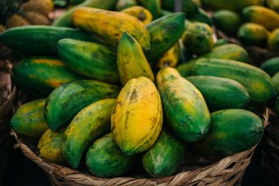 High angle view of fruits in wicker basket for sale at market