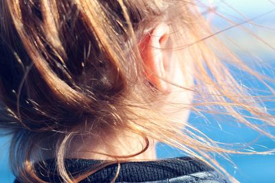 Close-up of woman against sky