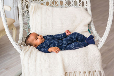 Cute boy sleeping on sofa