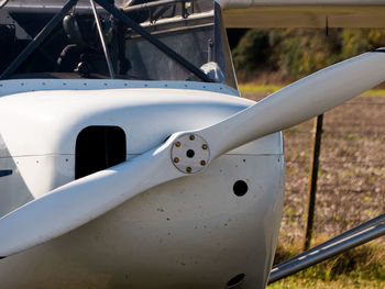 Close-up of airplane on field