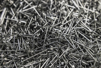 Full frame background showing lots of iron or metallic nails
