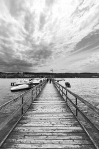 Pier over sea against sky