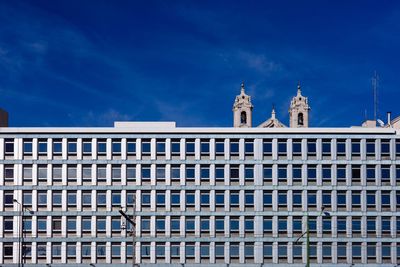 Low angle view of building against blue sky