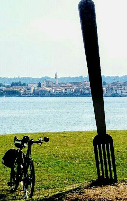 BICYCLES ON SHORE AGAINST SKY