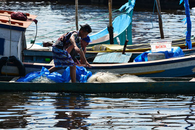 Fishing boats moored in sea