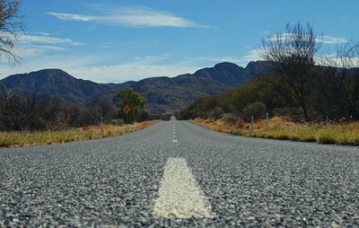 Surface level of road against mountain range