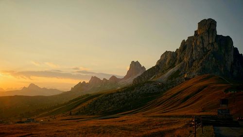 Scenic view of mountains against sky at sunset