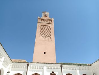 Low angle view of building against blue sky