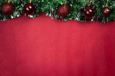 Close-up of christmas tree against wall