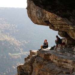 Friends sitting on cliff